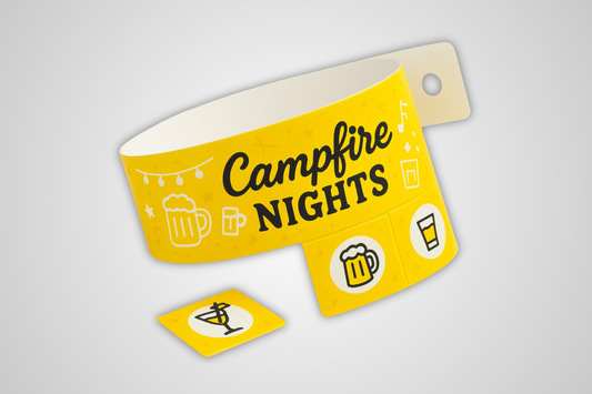 A photo of a yellow entrance wristband with detachable tickets