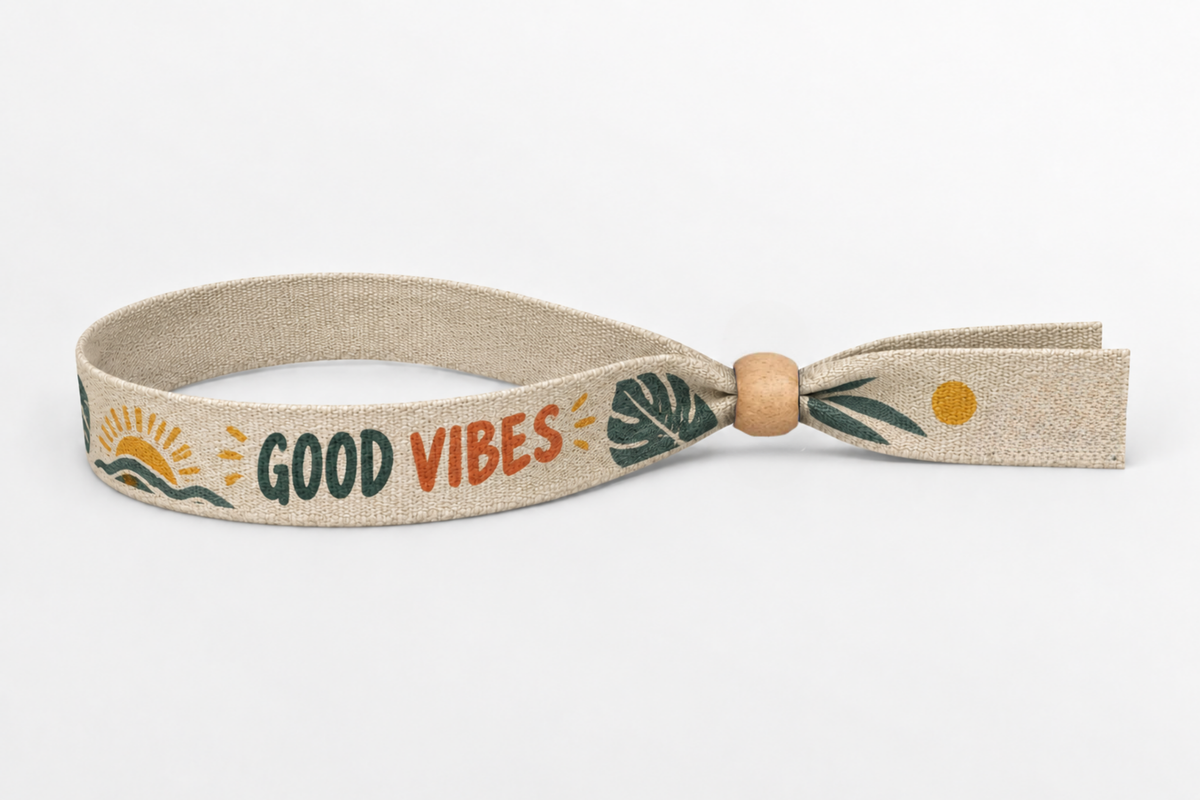 Beige puuvillaranneke, jossa värikäs Good Vibes -painatus