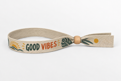 Beige puuvillaranneke, jossa värikäs Good Vibes -painatus